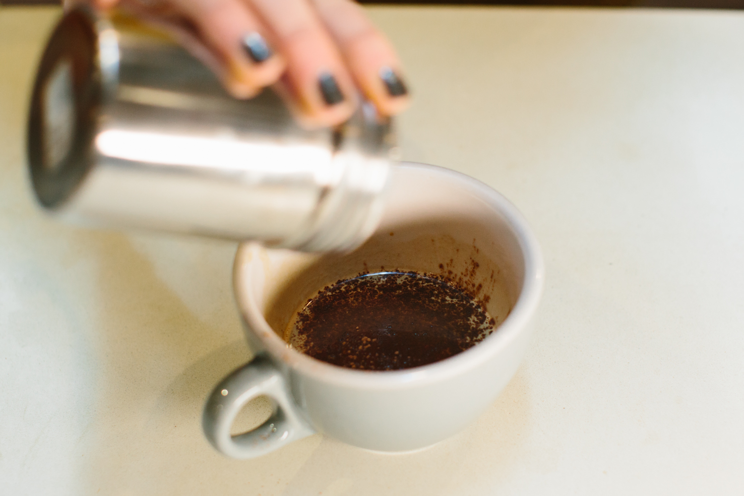 Image of cocoa powder going into a mug