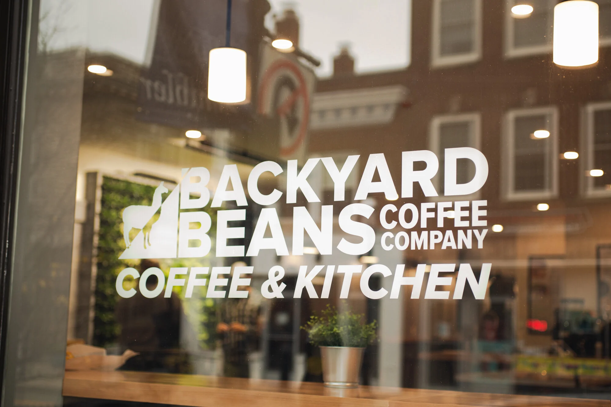 Image of entrance window of Backyard Beans Ambler