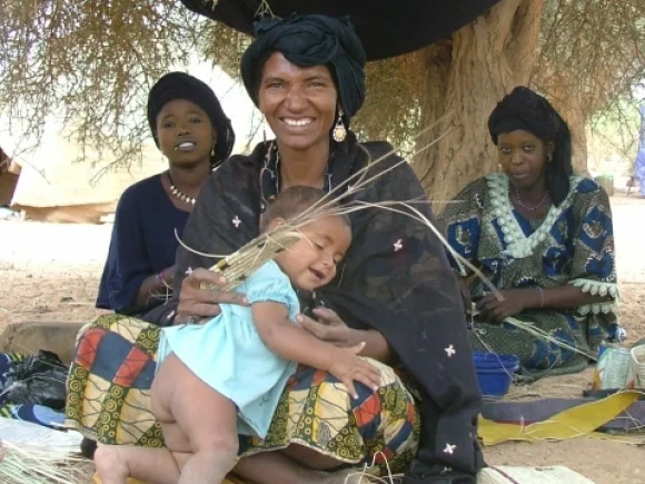 Coop woman with baby.jpg