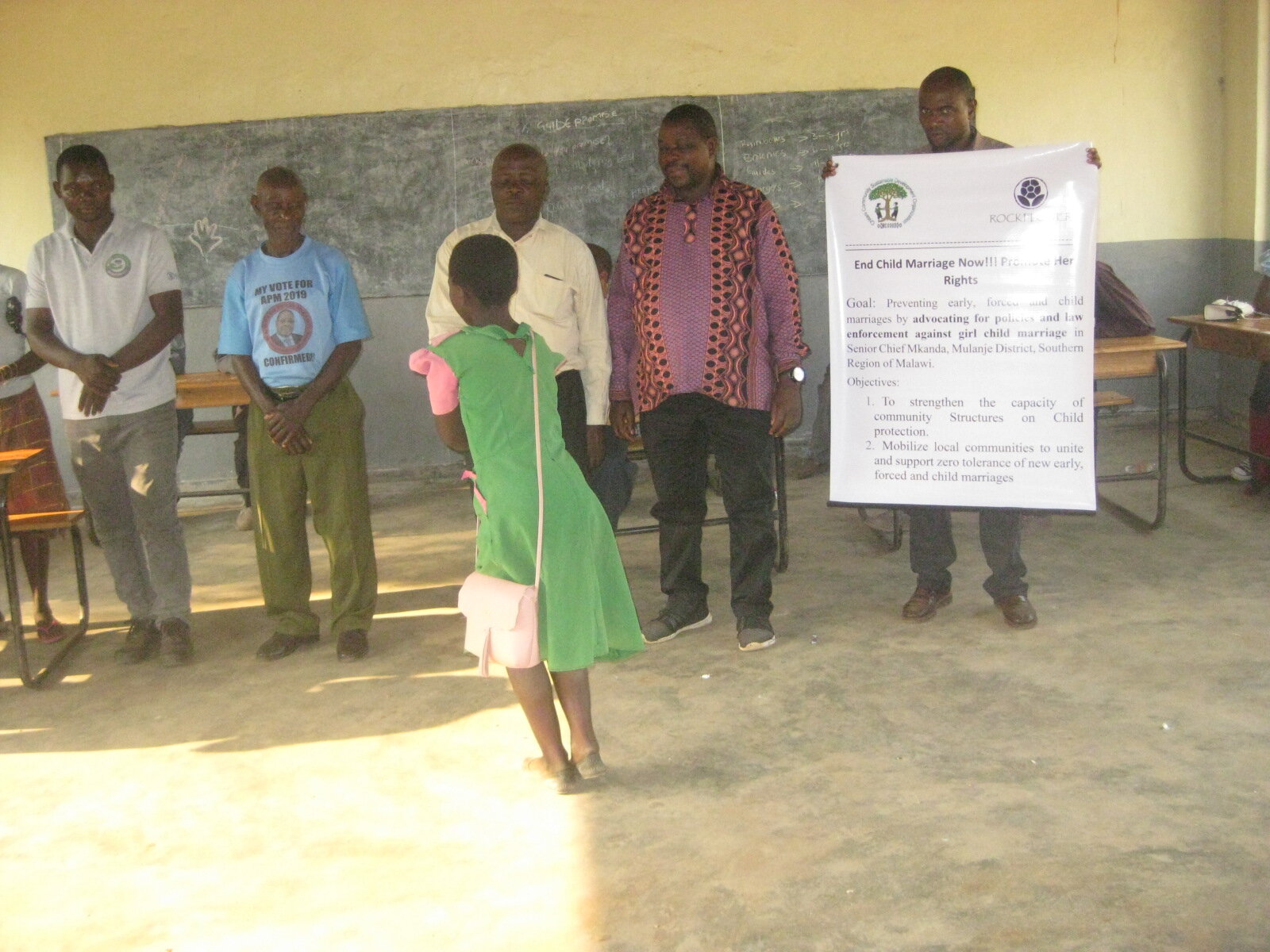 Alinafe recieving School Materials presented by Ward Councilor, Group Ntonya and Headteachers.JPG