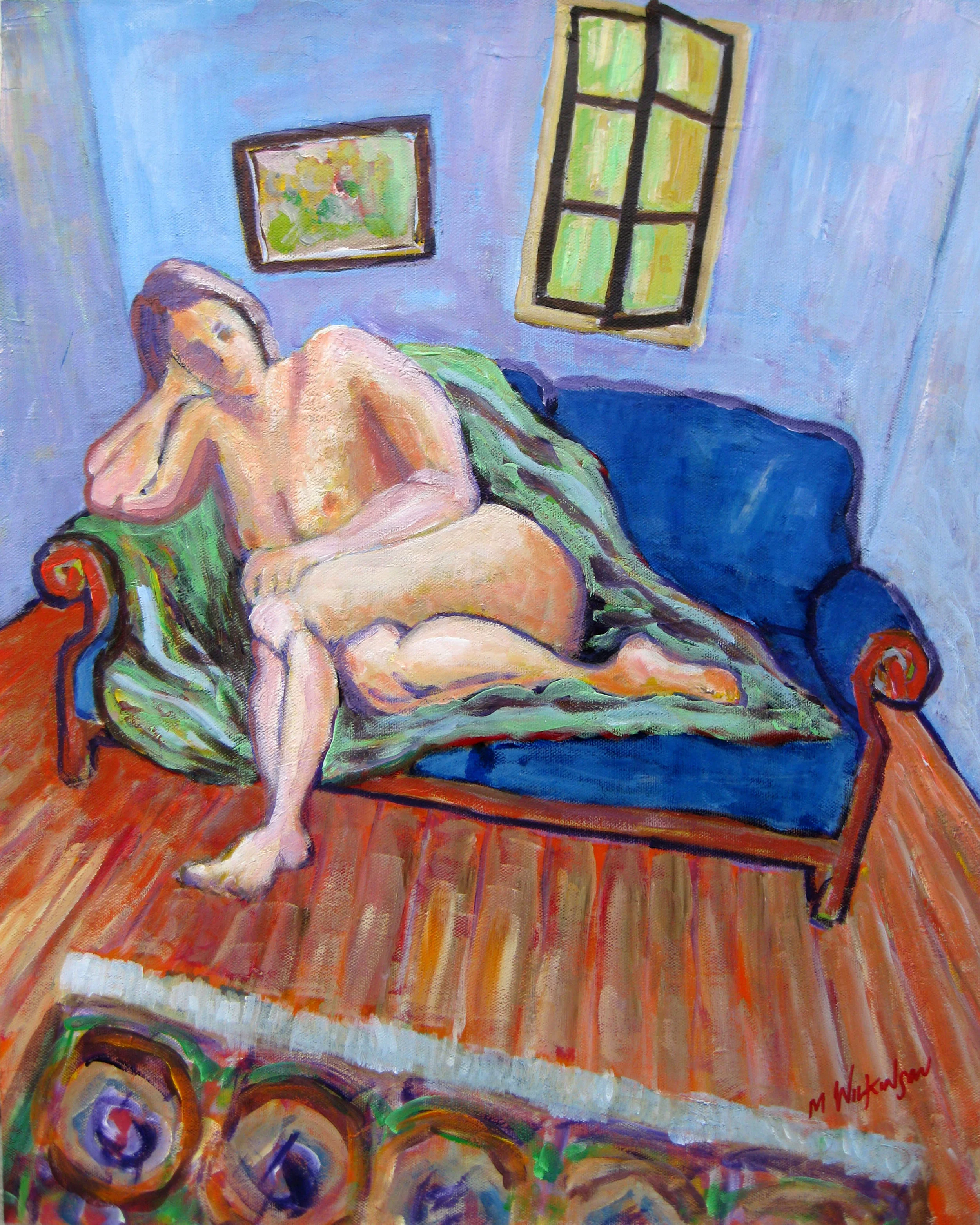nude on blue sofa