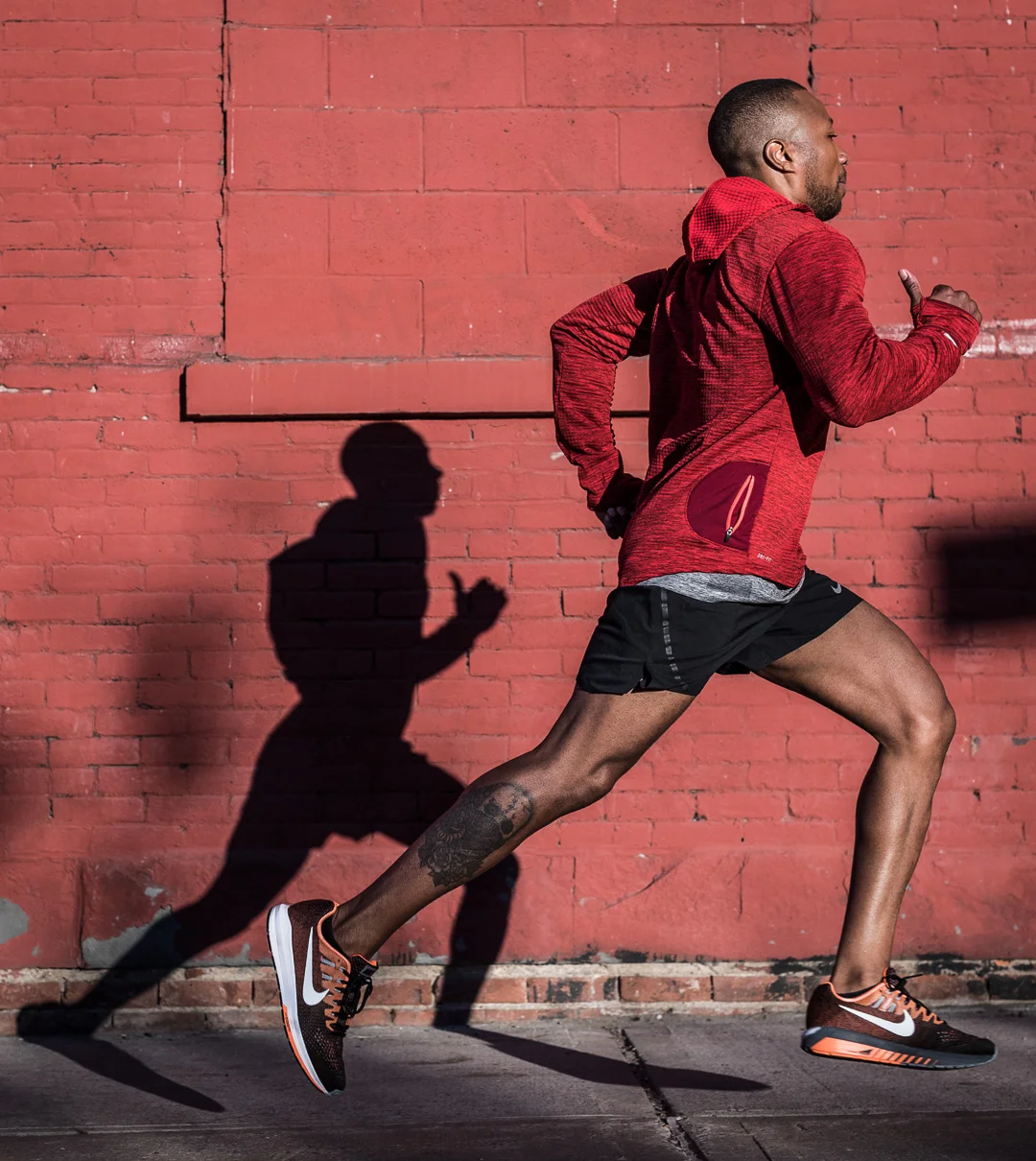Ashley Barker Photography Nike New York Running Shadows Brick Wall Red Jacket Shorts Concrete
