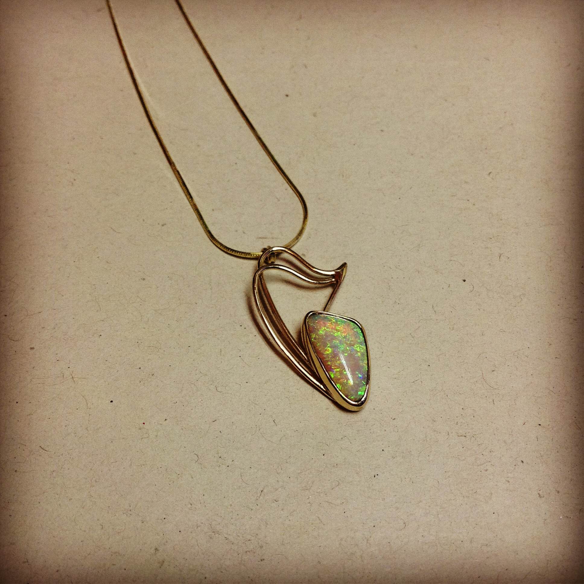 Opal gold pendant