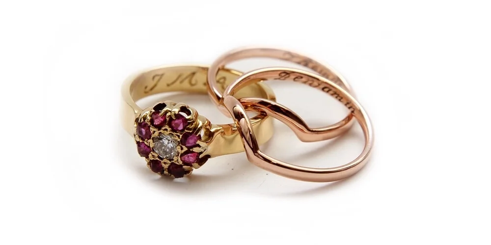 New and improved Ruby ring accompanied by two rose gold contoured bands.