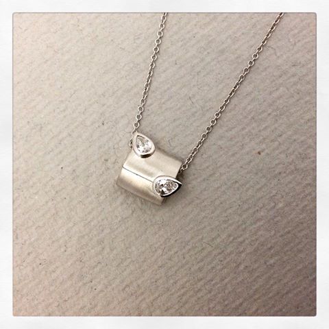 A bespoke Platinum pendant using customers own diamonds