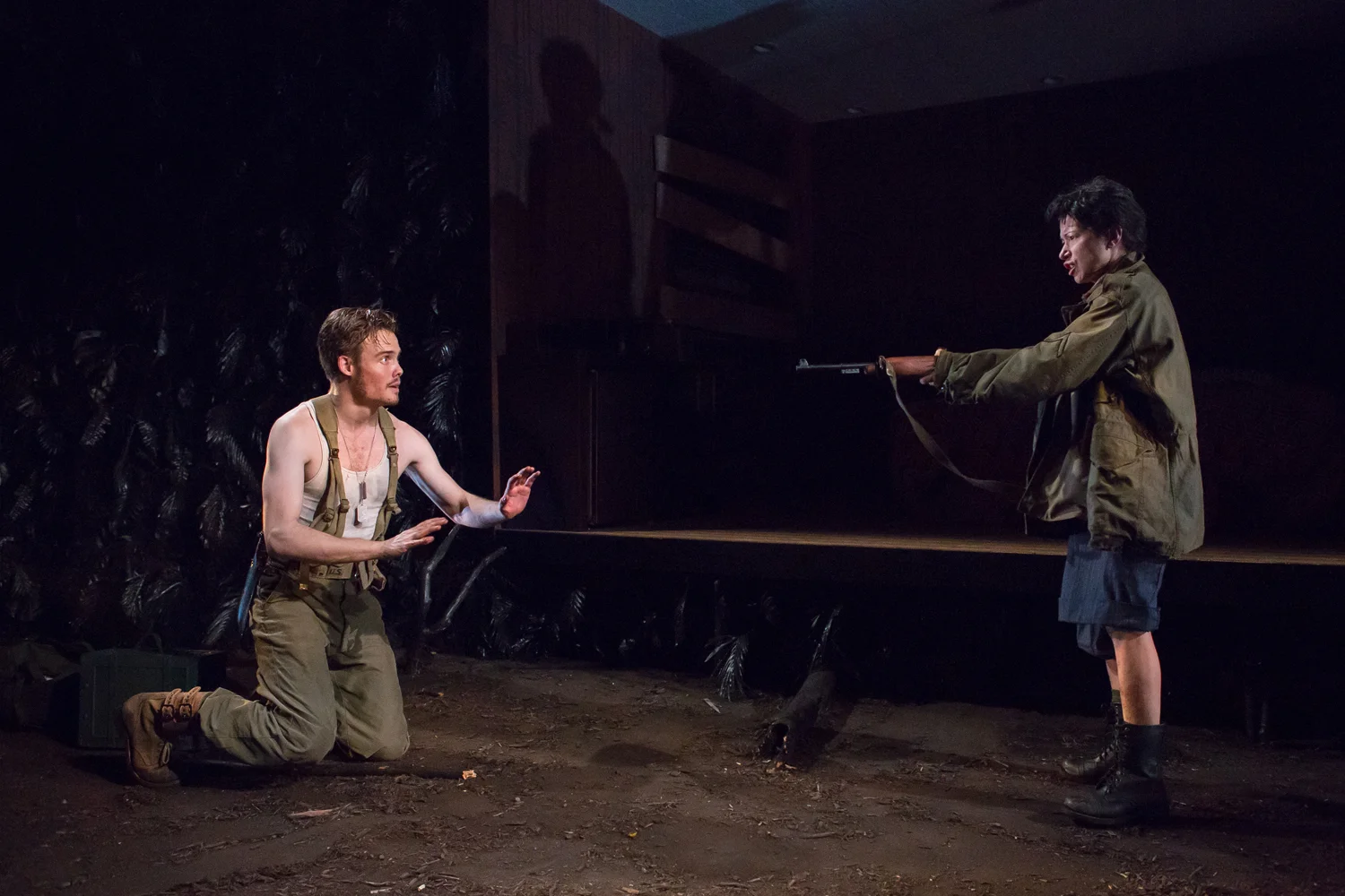 Anna as Number Four, confronting Luke in the jungle (downstage of hotel room)