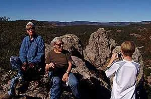 Three generation family enjoying views from rock formations
