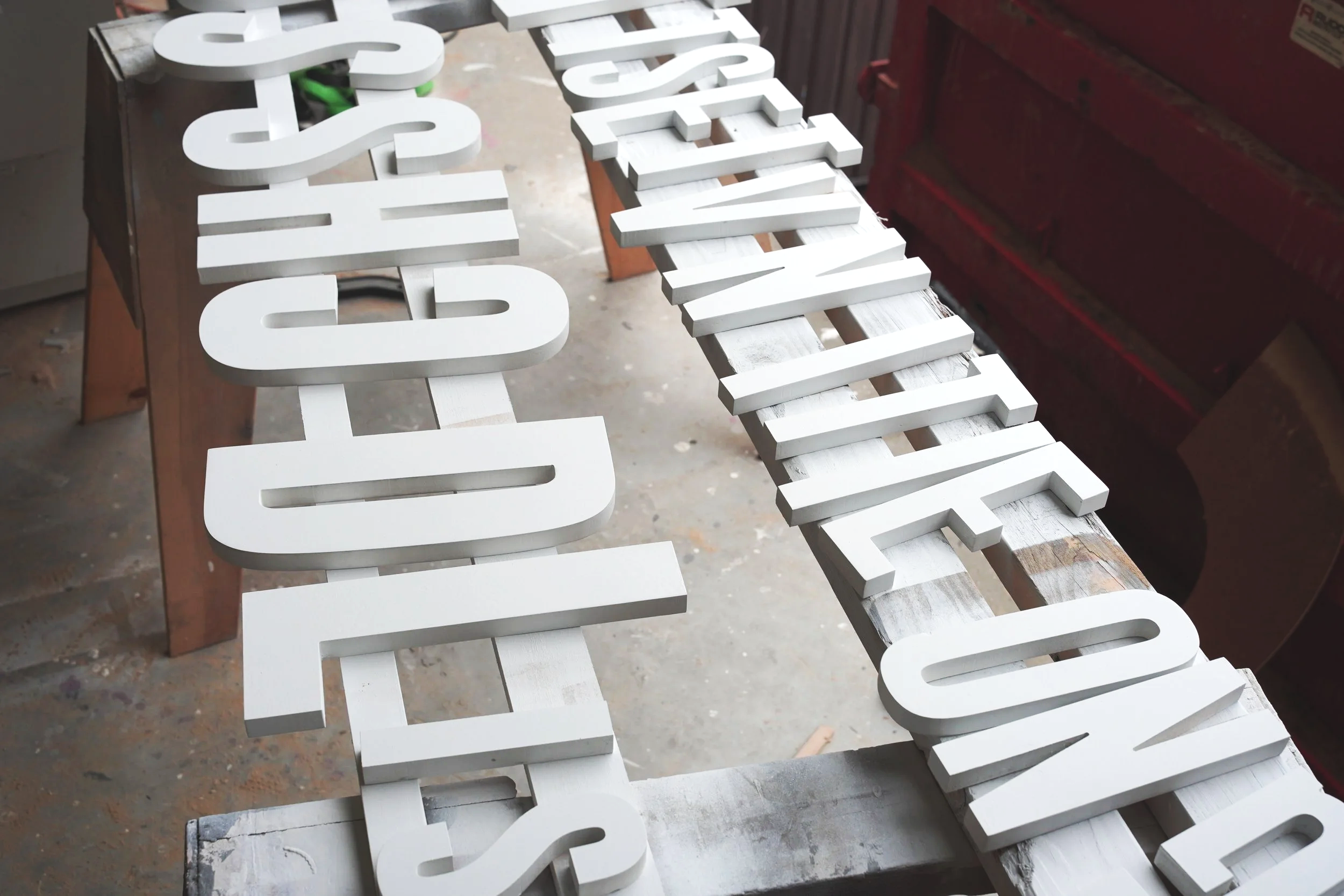 Custom dimensional lettering fabricated in the GREENE shop for branded event installation.