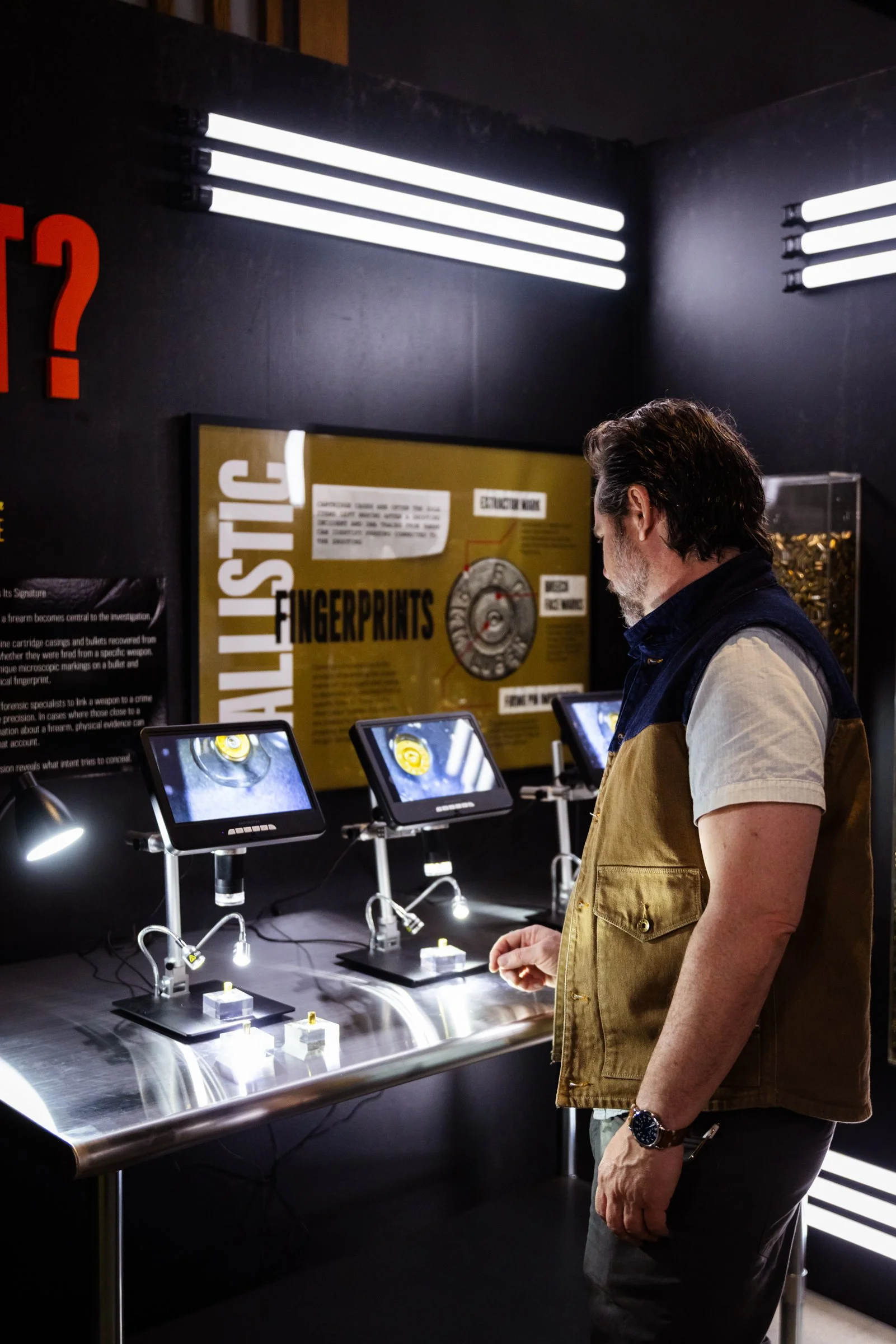 Interactive exhibit station with custom product shelving, scenic walls, and visitor engagement elements.