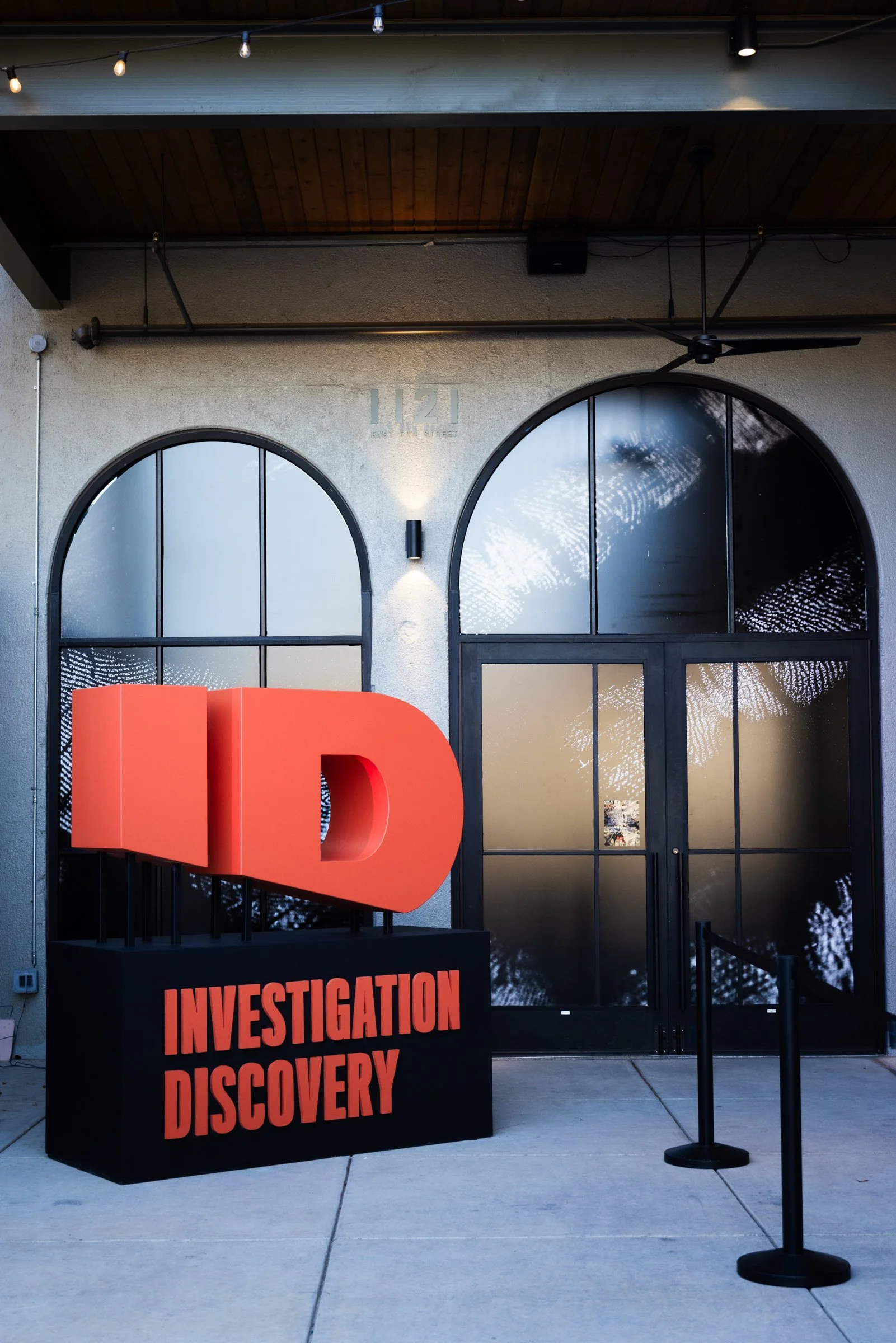 Branded entrance display with custom dimensional signage for an experiential event activation.