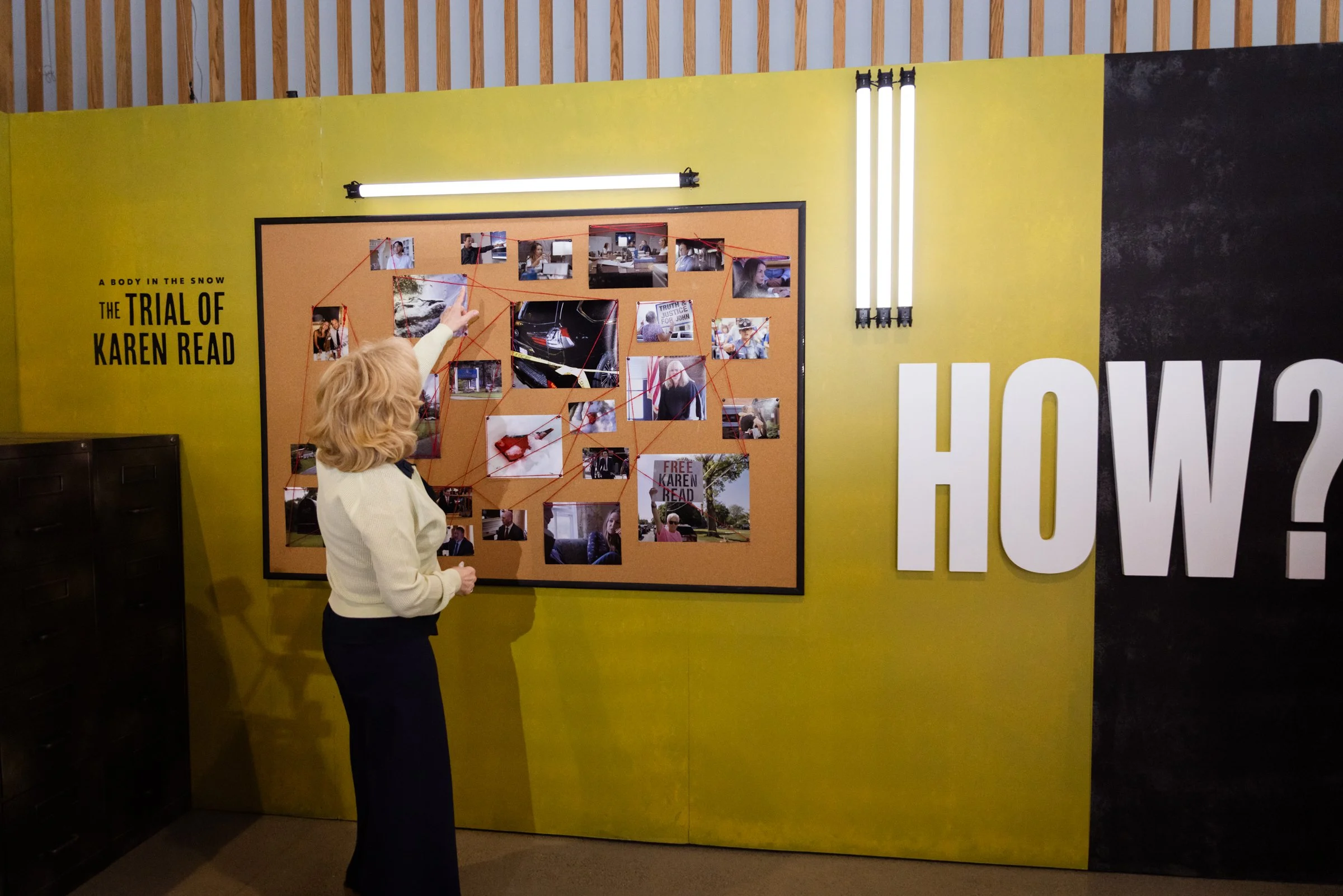Interactive brand activation wall with photo collage, custom graphics, and visitor engagement display.