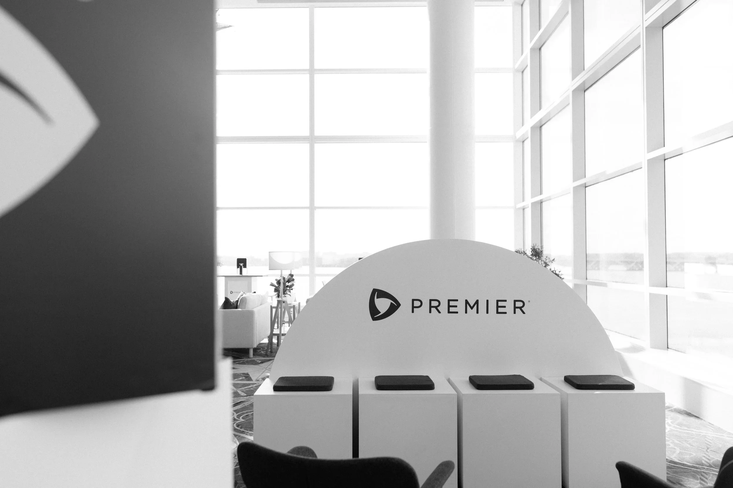 Custom branded check-in display with dimensional signage for corporate event registration.