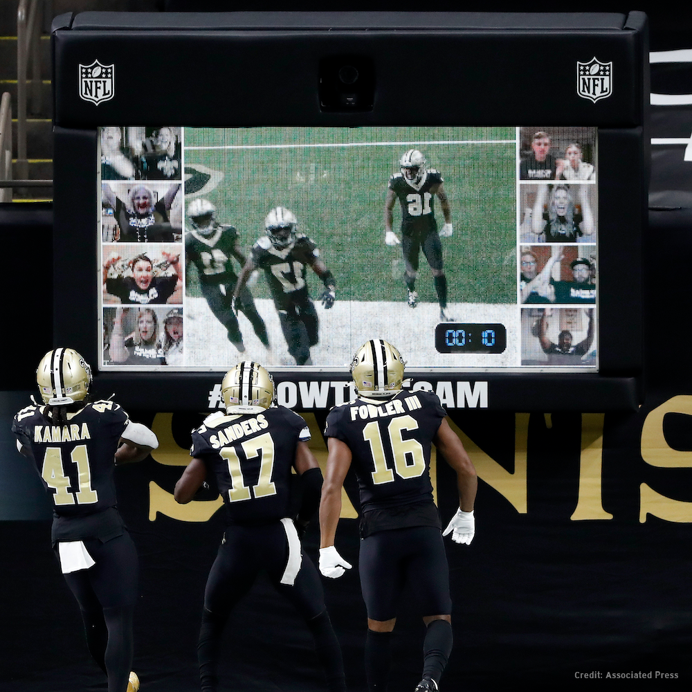 Custom football-themed interactive display with branded screen, props, and event graphics.