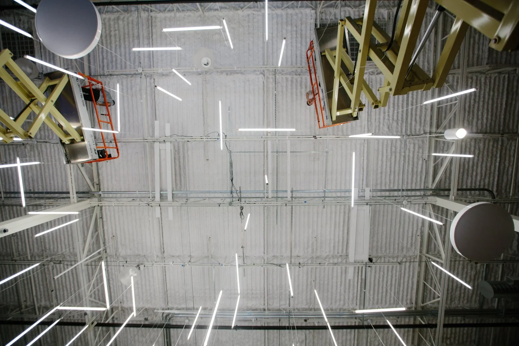 Overhead view of custom lighting installation inside event space.