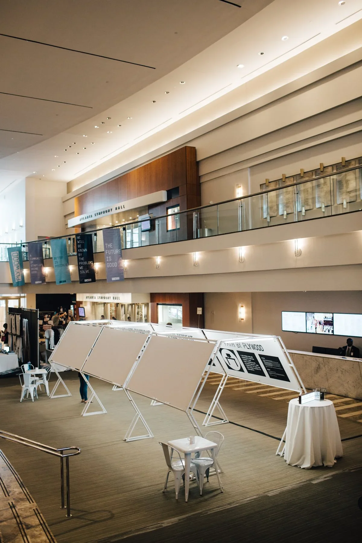 Trade show and event display area with custom exhibit panels and branded information stations.