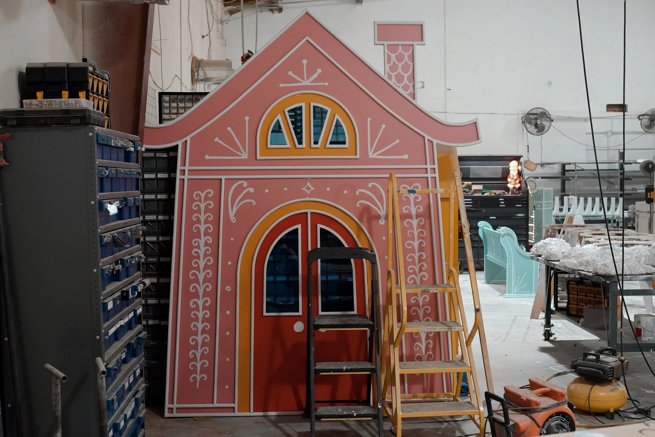 GREENE fabrication shop with custom house facade scenic build in progress.