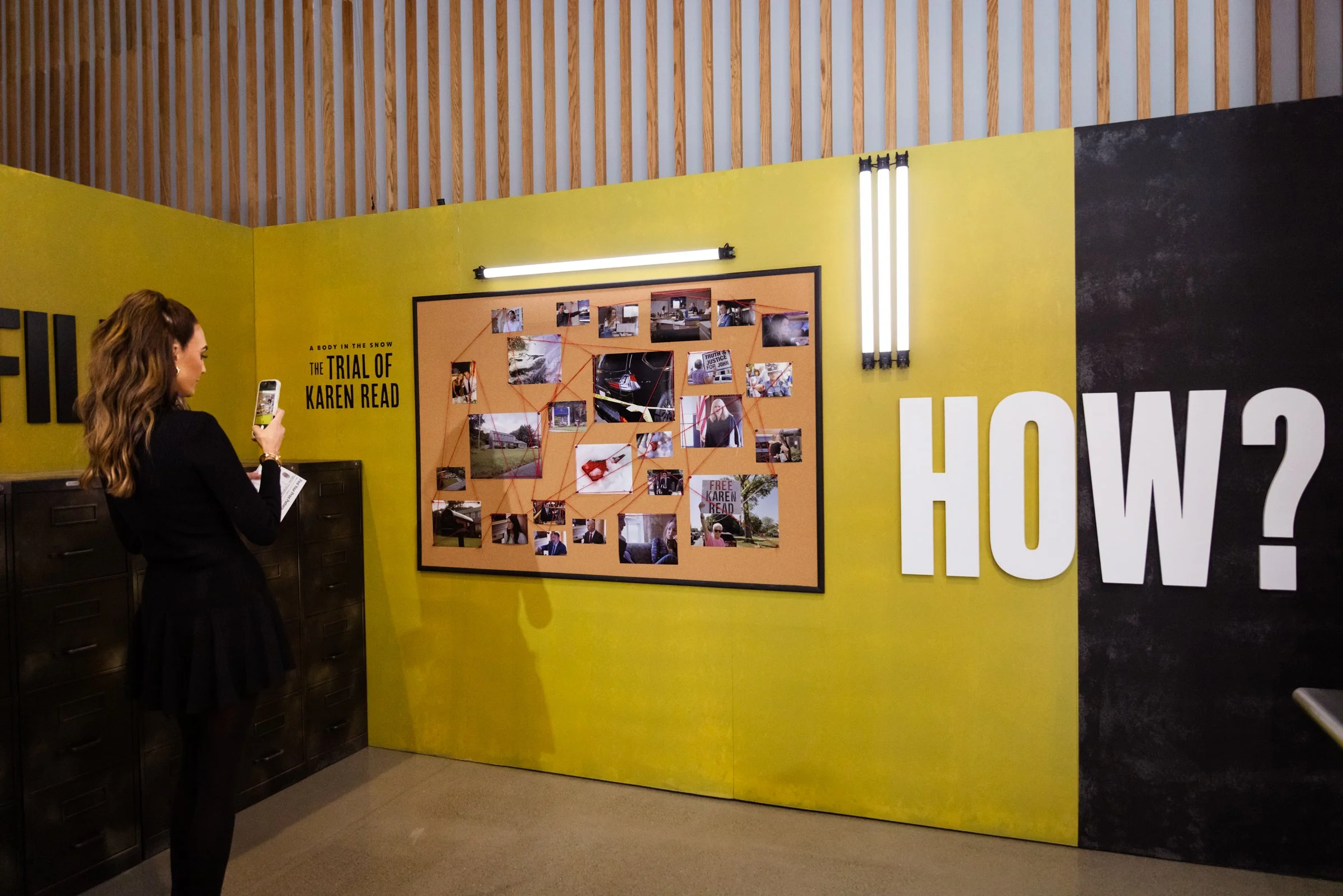 Interactive brand activation wall with photo collage, custom graphics, and visitor engagement display.