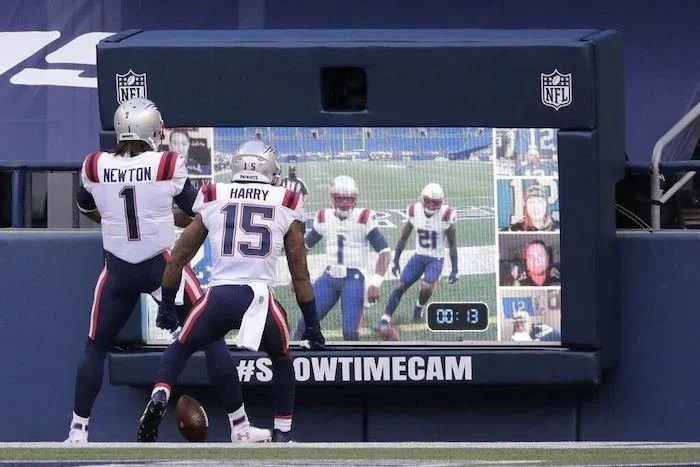 Interactive football camera display with custom branded screen and sports activation graphics.