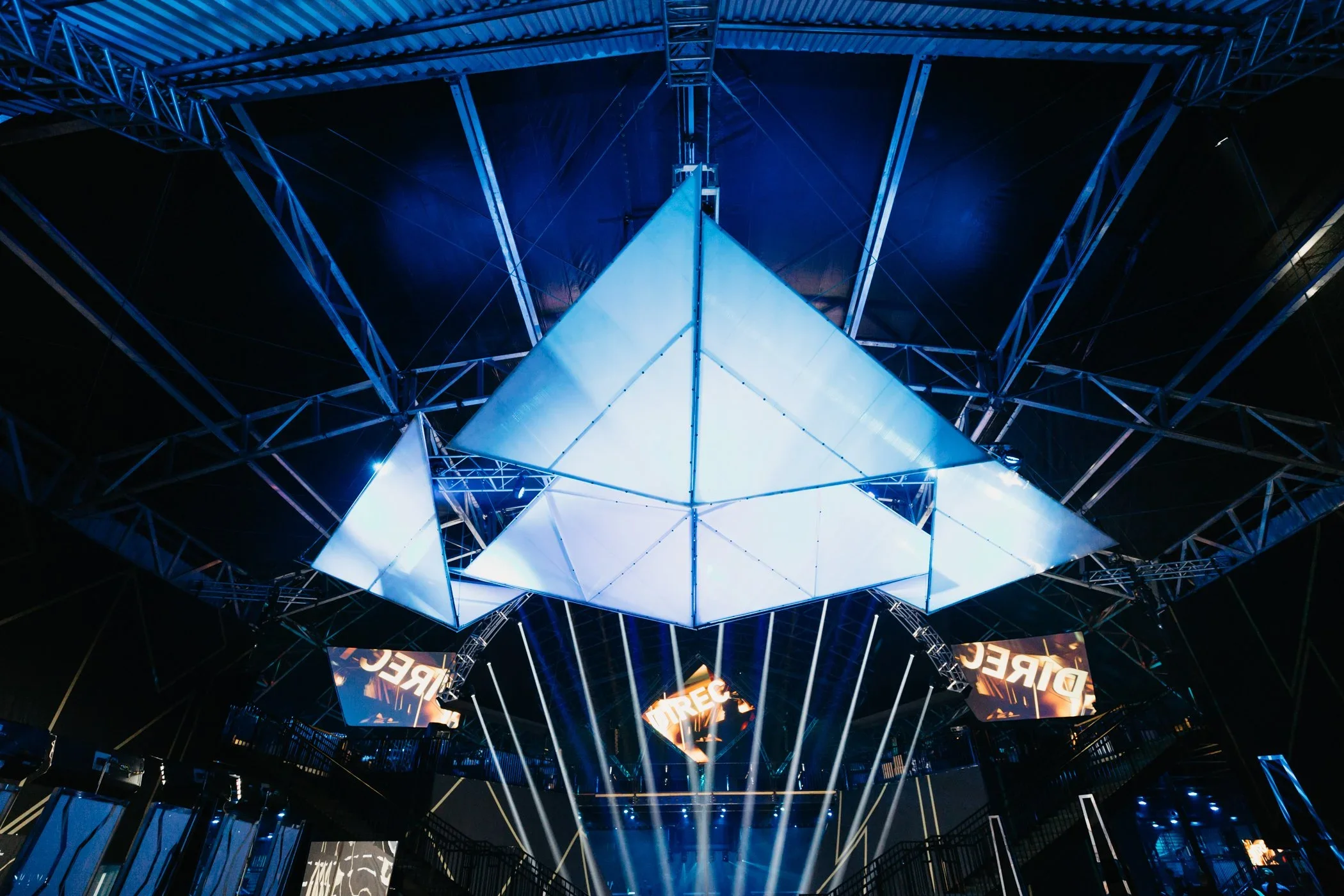 Suspended pyramid lighting installation for an experiential event.