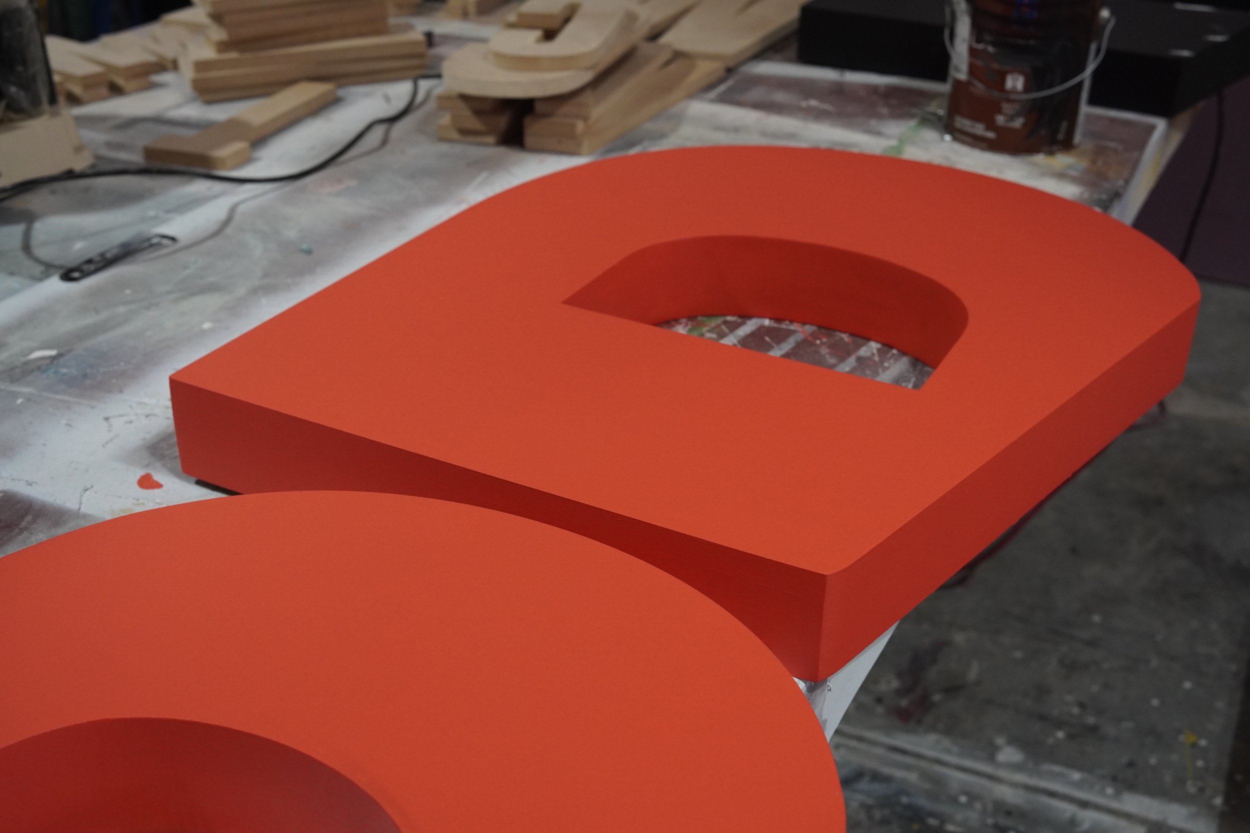 Painted dimensional letterforms fabricated in the GREENE shop for branded event display.