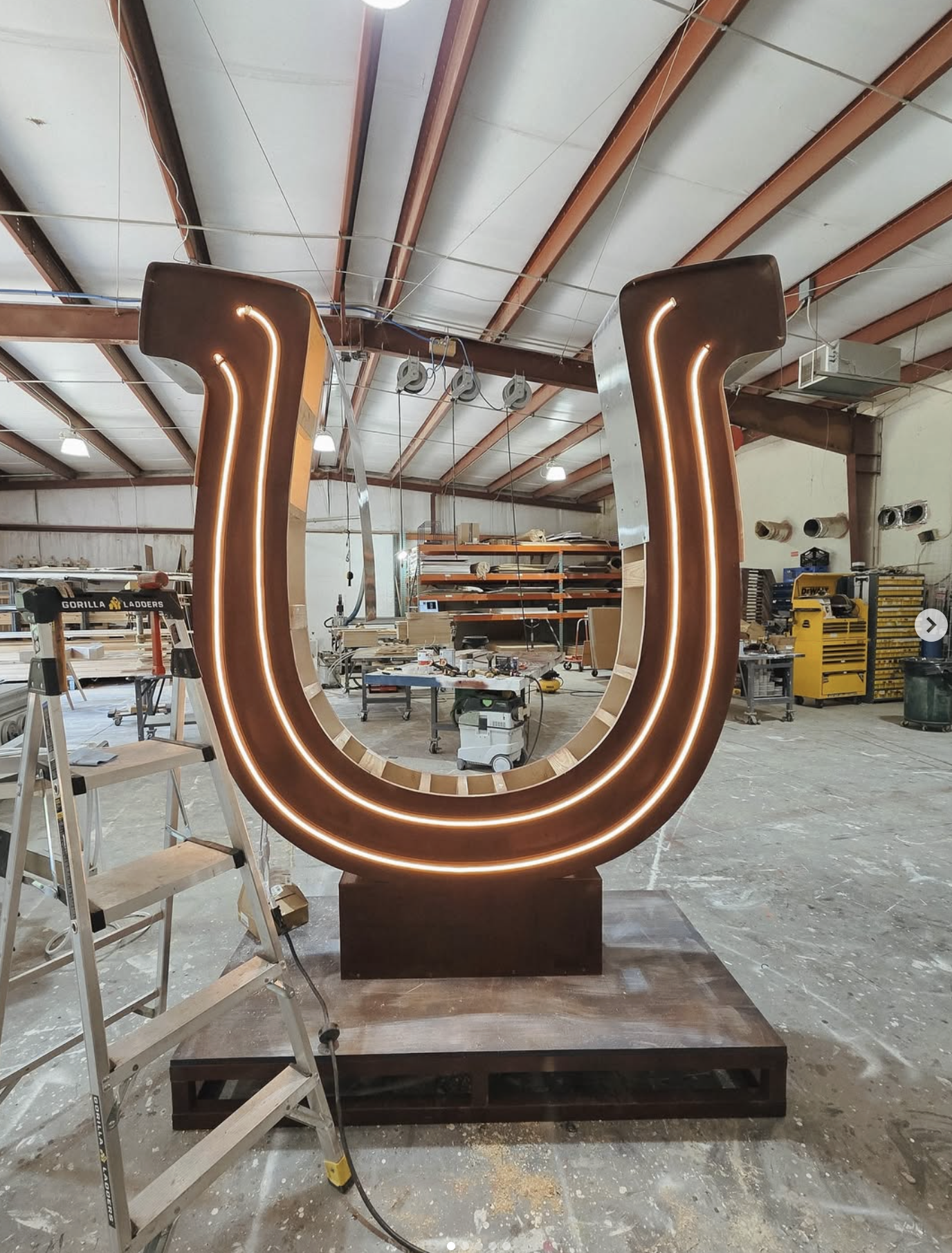Custom illuminated horseshoe prop for country shows, concerts, and branded events.