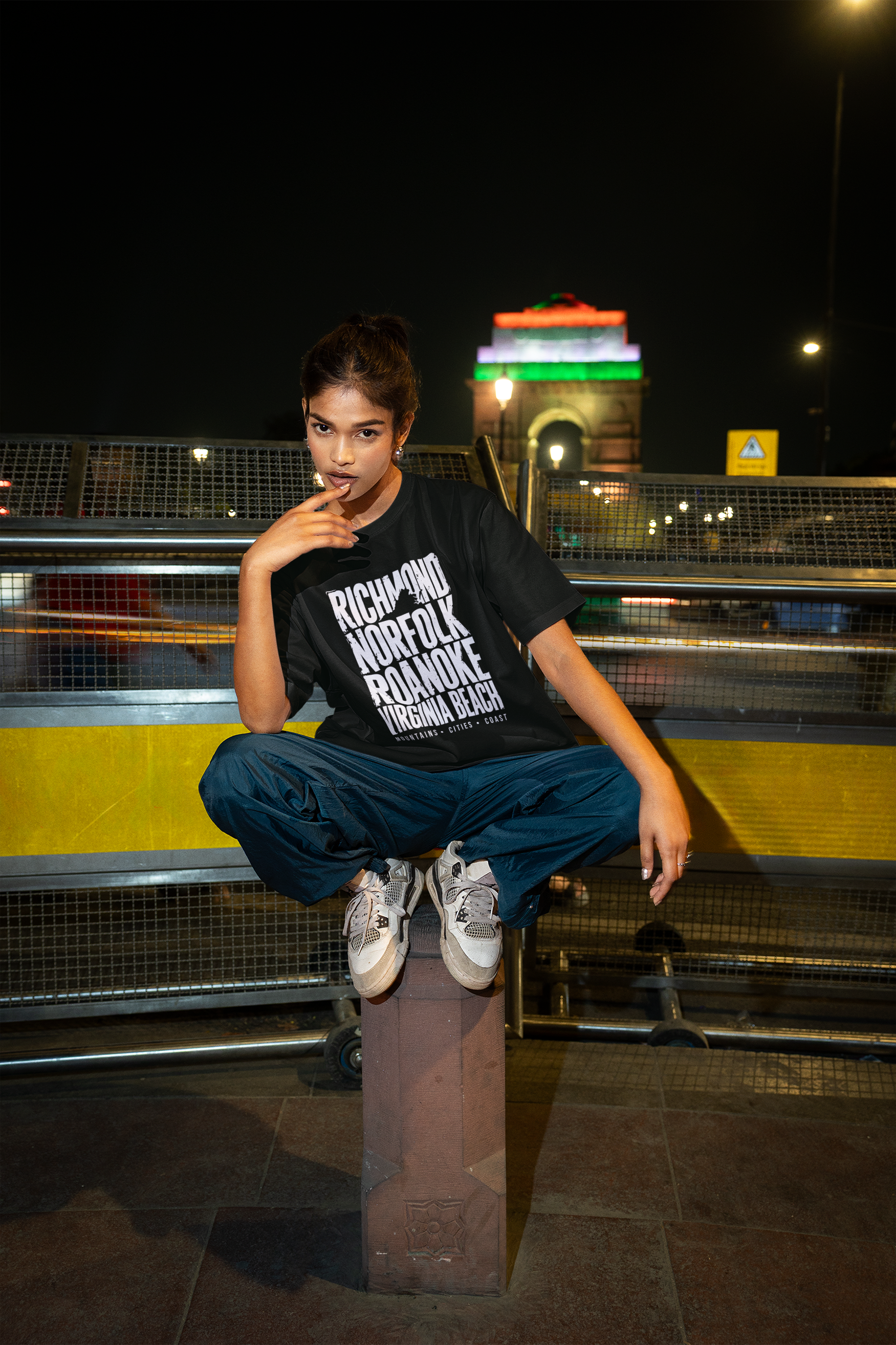 oversized-t-shirt-mockup-with-a-stylish-model-and-blurred-background-traffic-lights-at-night-m56846.png