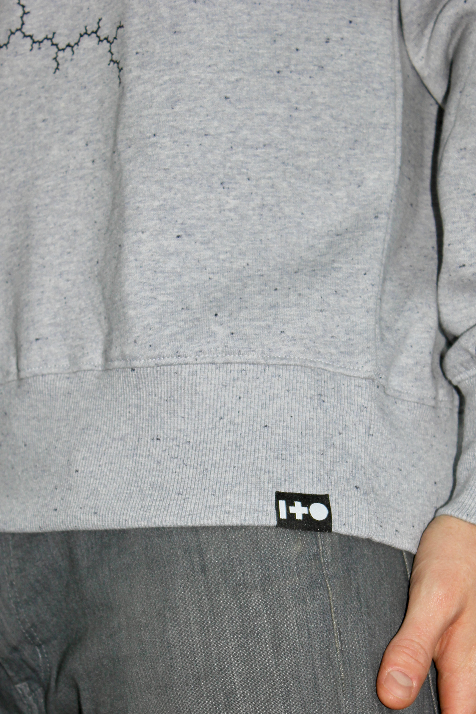 Julia Set Grey Marl Sweatshirt with one and other logo hem label.png