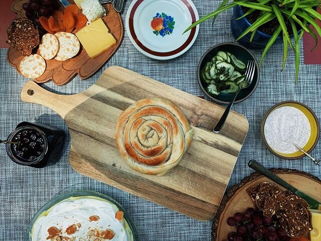 Afternoon spread.

Burek: Azerbaijani regional phyllo dough pastry filled with cheese. To be eaten with a sumac yogurt sauce or Turkish sour cherry preserves. Pickles, cheeseboard spread, and banana pudding to keep the whole situation &ldquo;local&rd