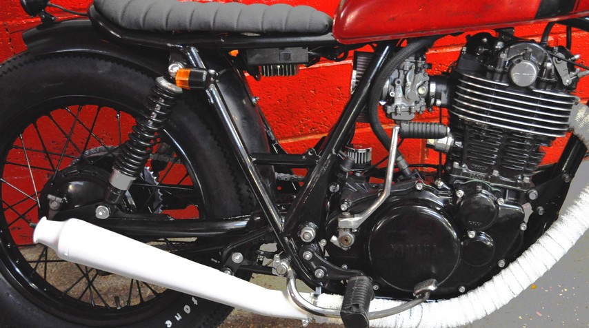 High temperature white painting of the exhaust to match the grips. And why not?