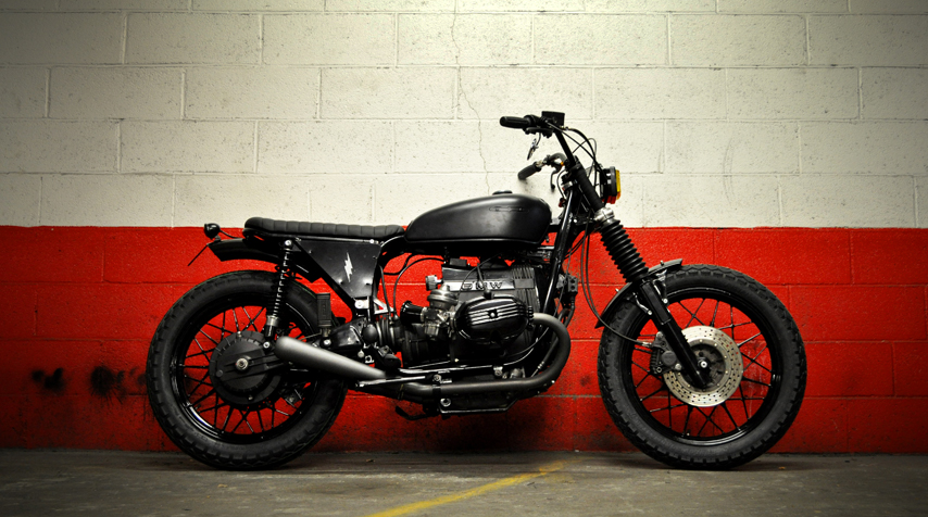 - 100% reconditioned BMW R100 RT from 1979; - shiny black powder coating of the frame, wheels, handlebar, all engine covers; - 100% hand made rear loop + bespoke seat.