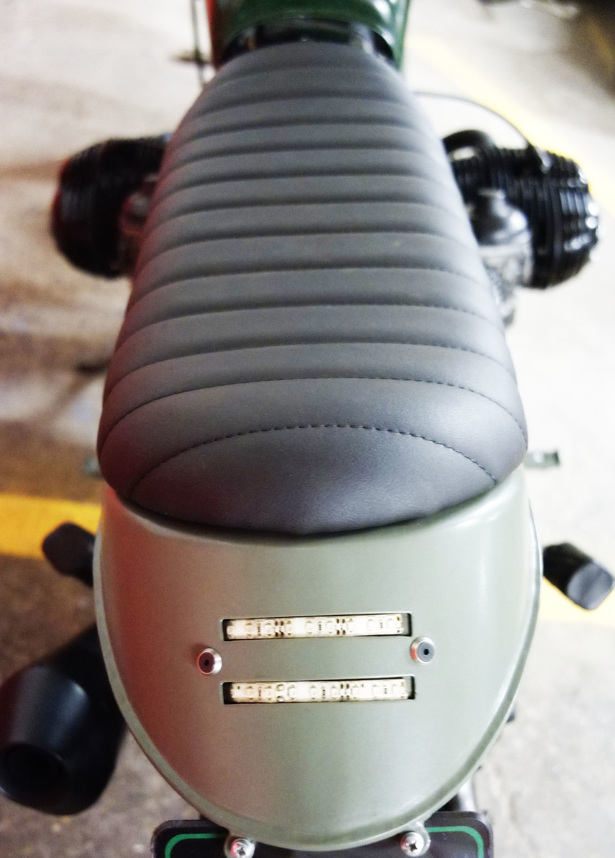 - Bespoke rear loop welded on the frame, and hosting both tail and stop lights (made of LED); - bespoke seat designed to match the rear loop.