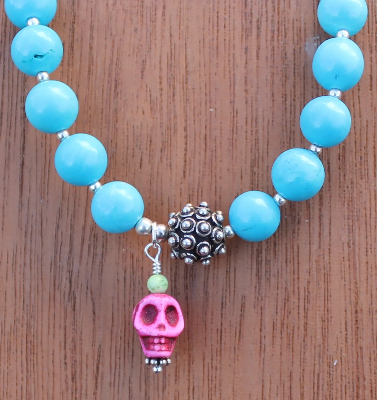 pink skull bracelet