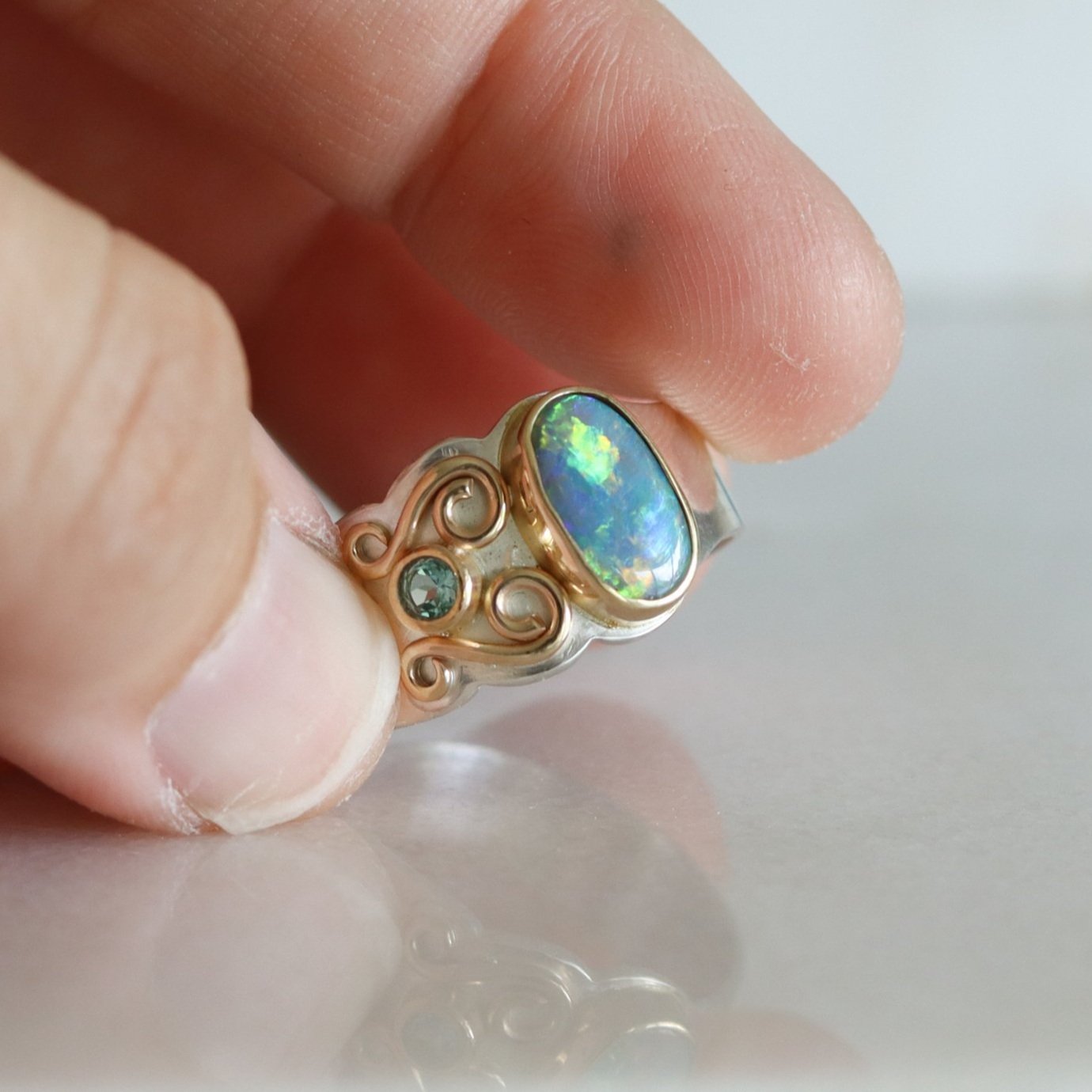 large Australian opal ring with silver gold and apatite