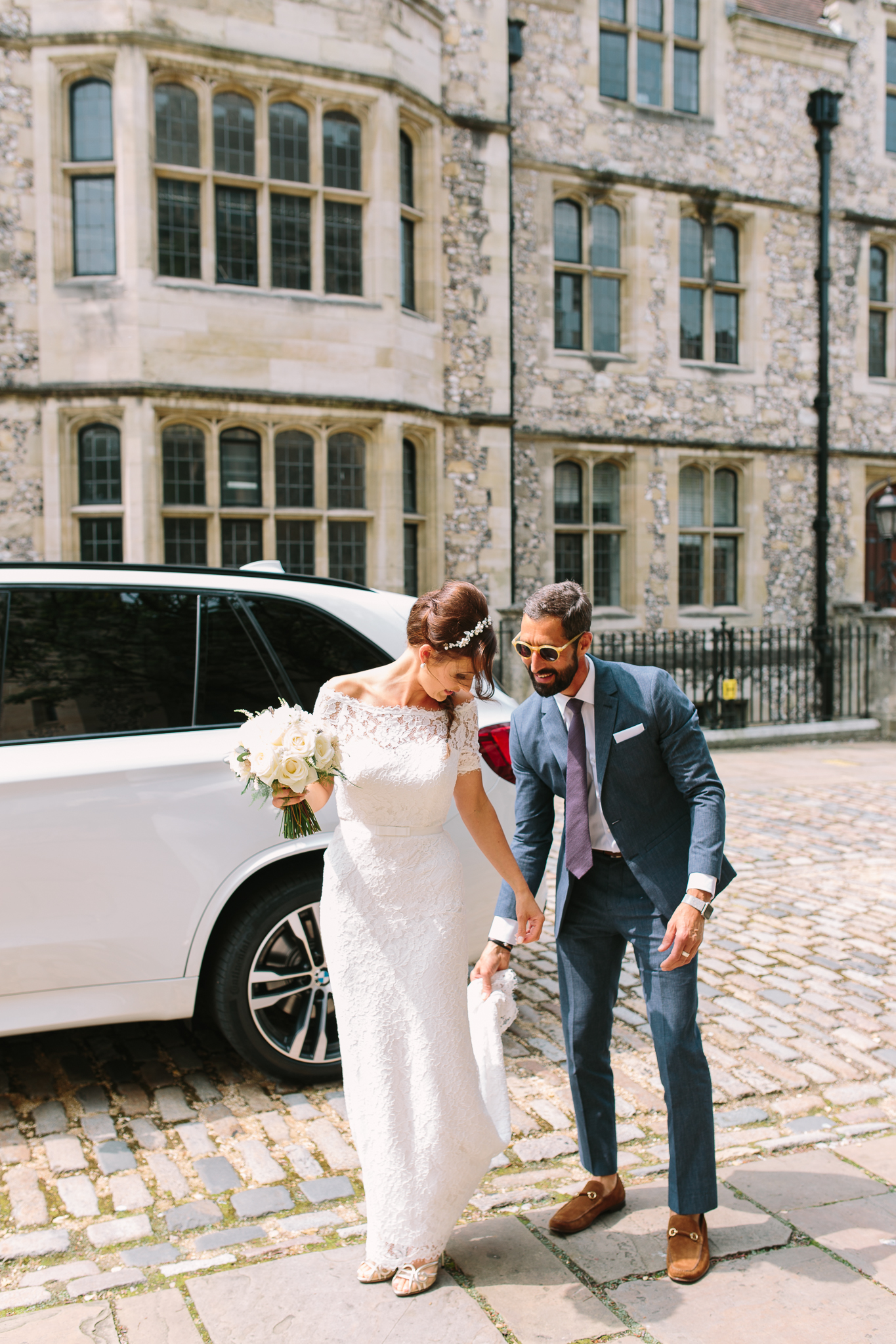 father holding daughters wedding dress