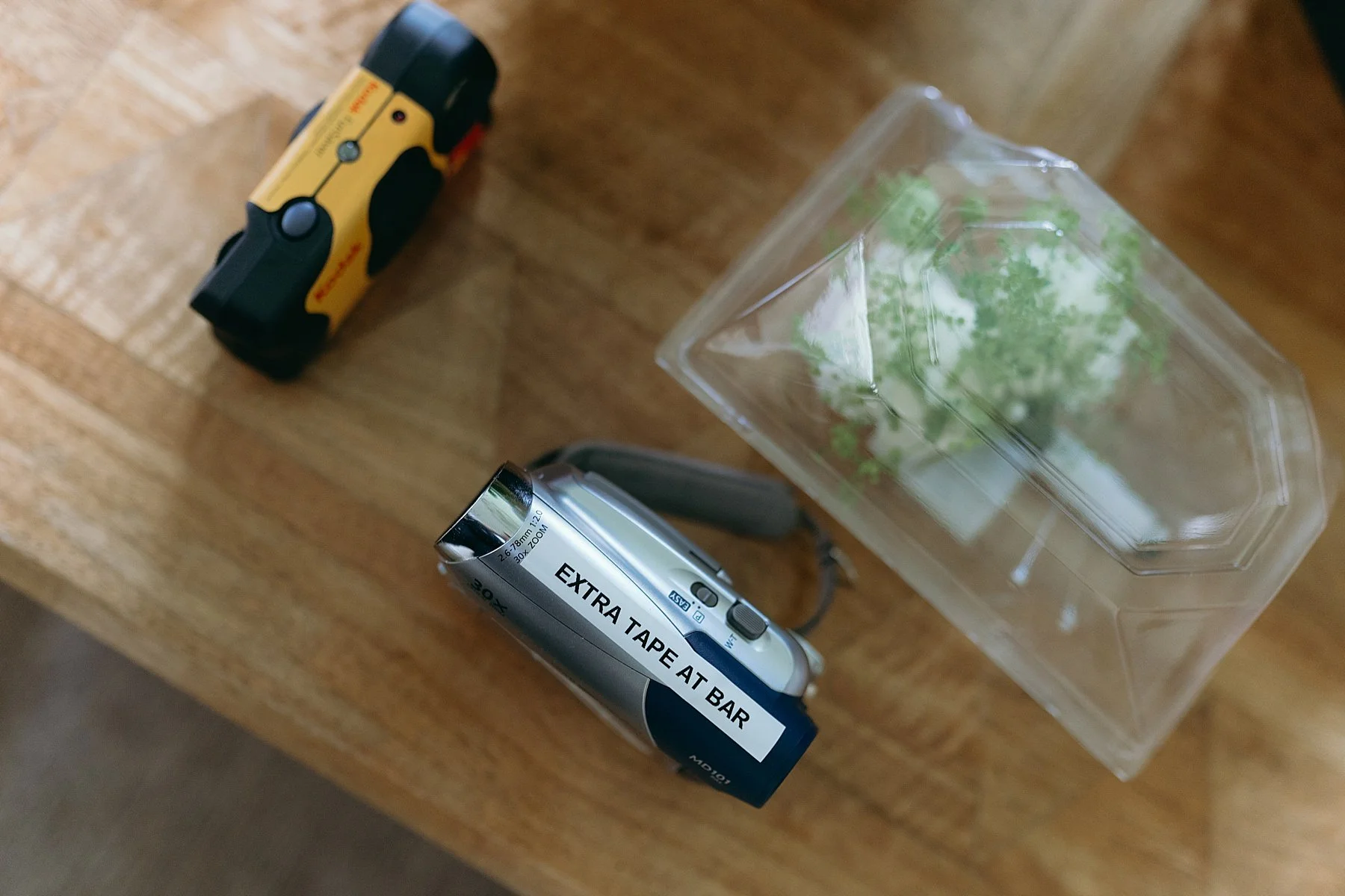 camcorder and film camera ready to be taken to a wedding