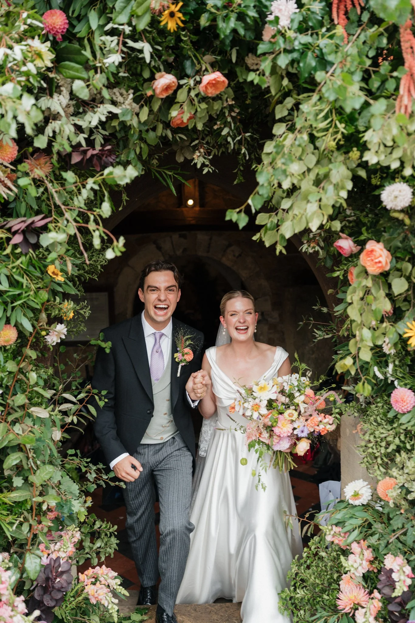 Hampshire wedding at a church with a big flower arch