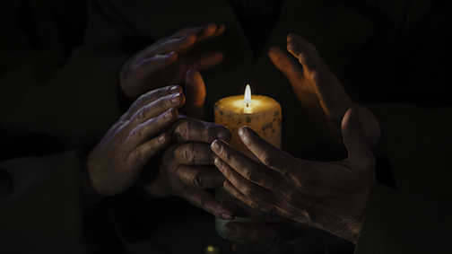 hands candle.png