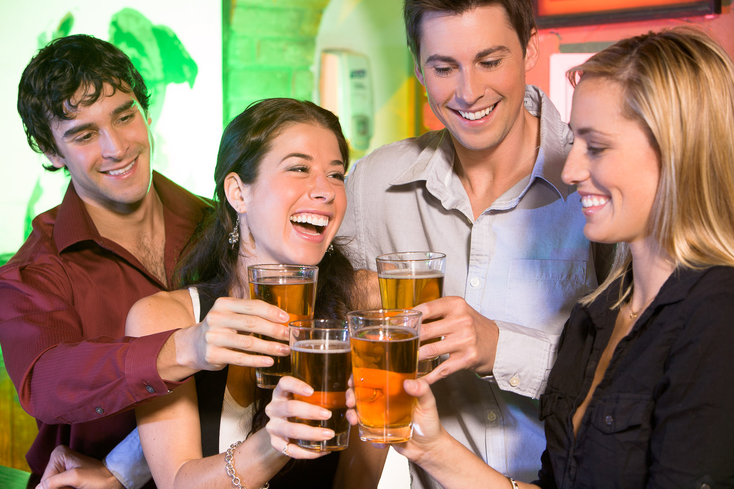 young adults celebrating with beers.jpg