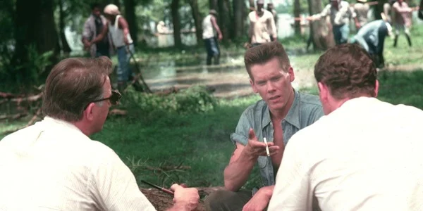 Kevin Bacon talks to Kevin Costner and Jay O. Sanders in Oliver Stone's JFK