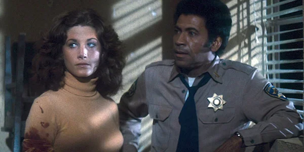 Laurie Zimmer and Austin Stoker in John Carpenter’s Assault on Precinct 13