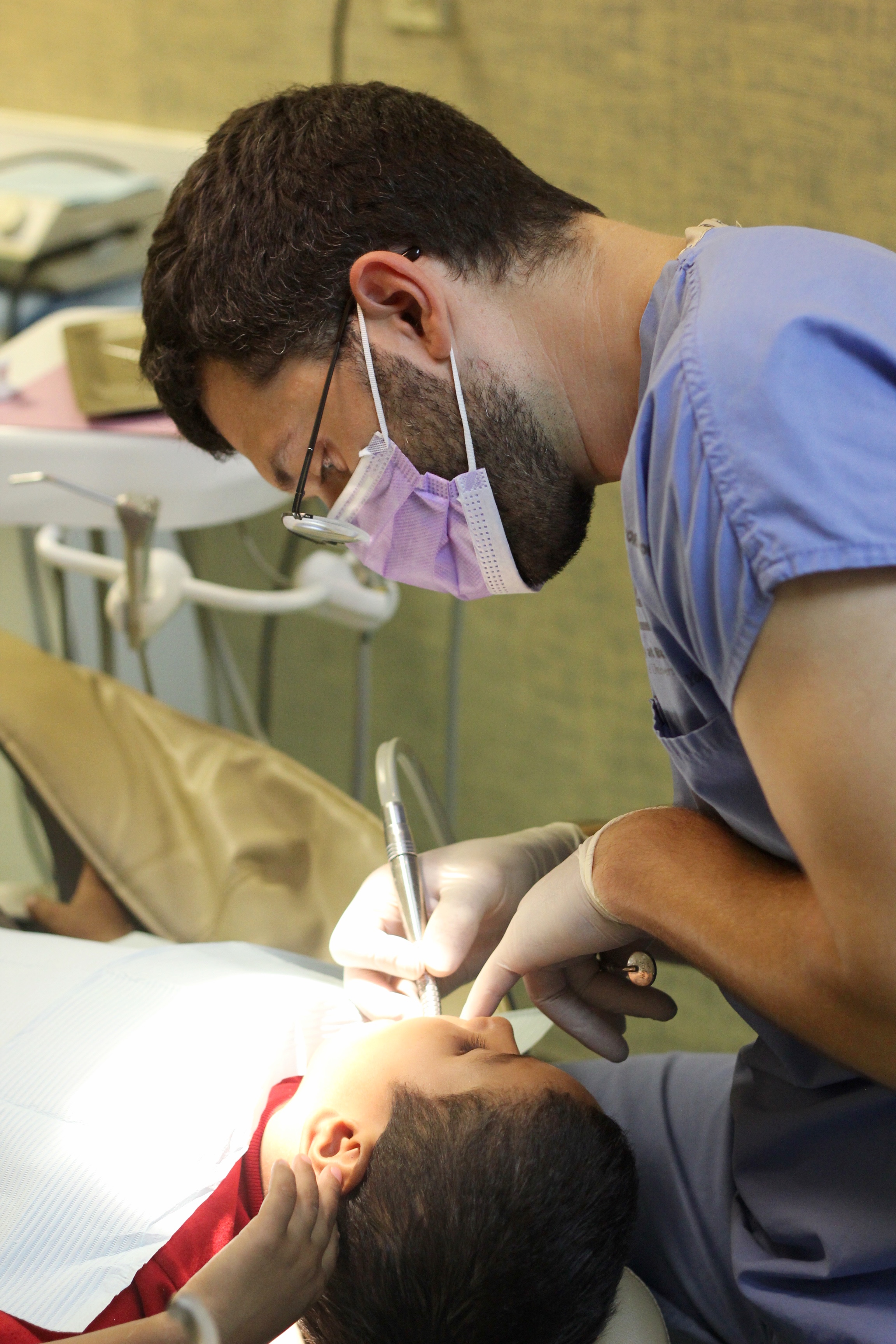 Dr. Ryan Colosi working on teeth. 