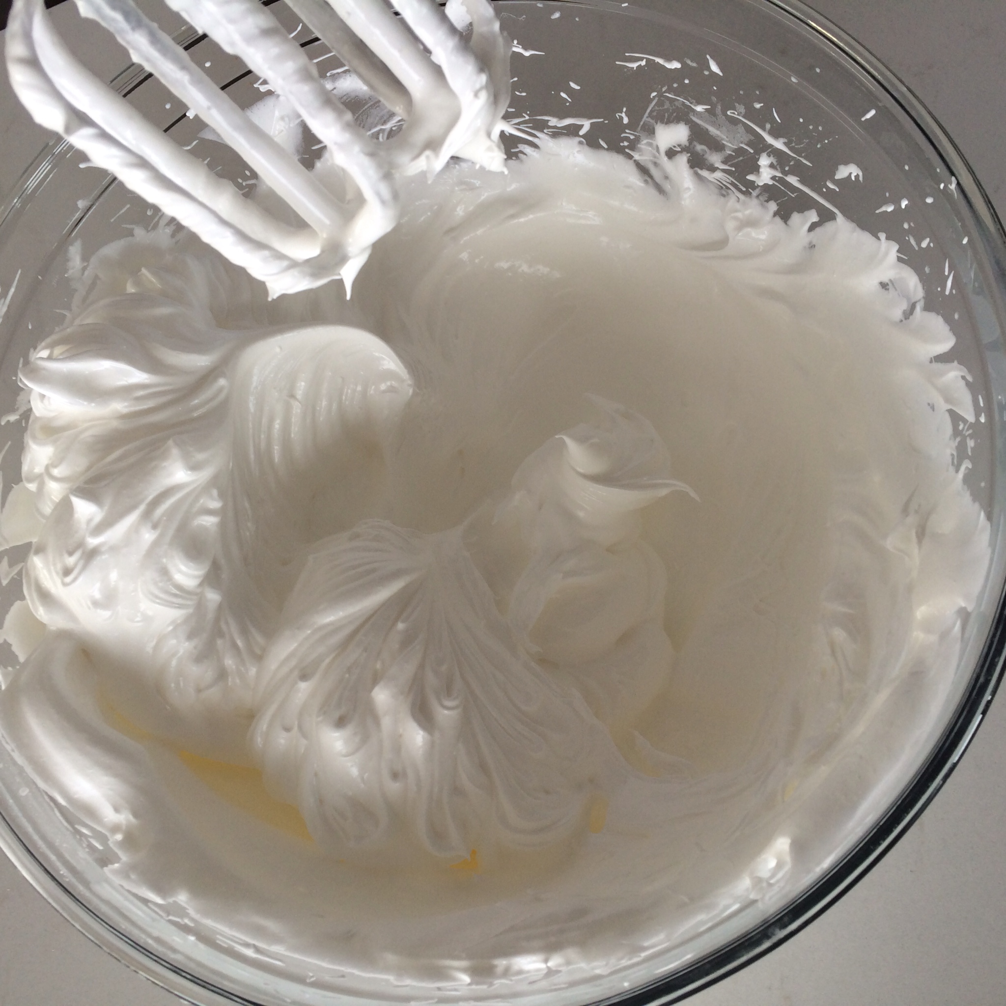 Whipping egg whites until soft peaks form...