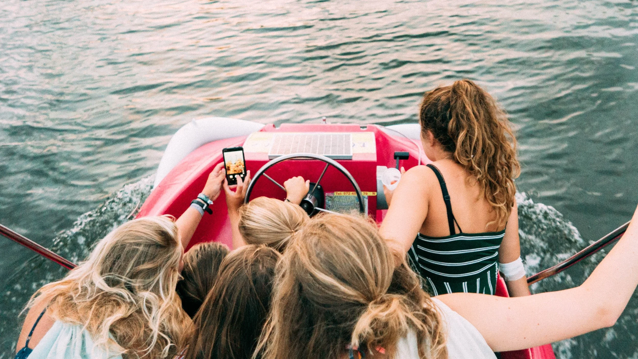 Teens-on-boat-daan-stevens-1167546-unsplash.jpg