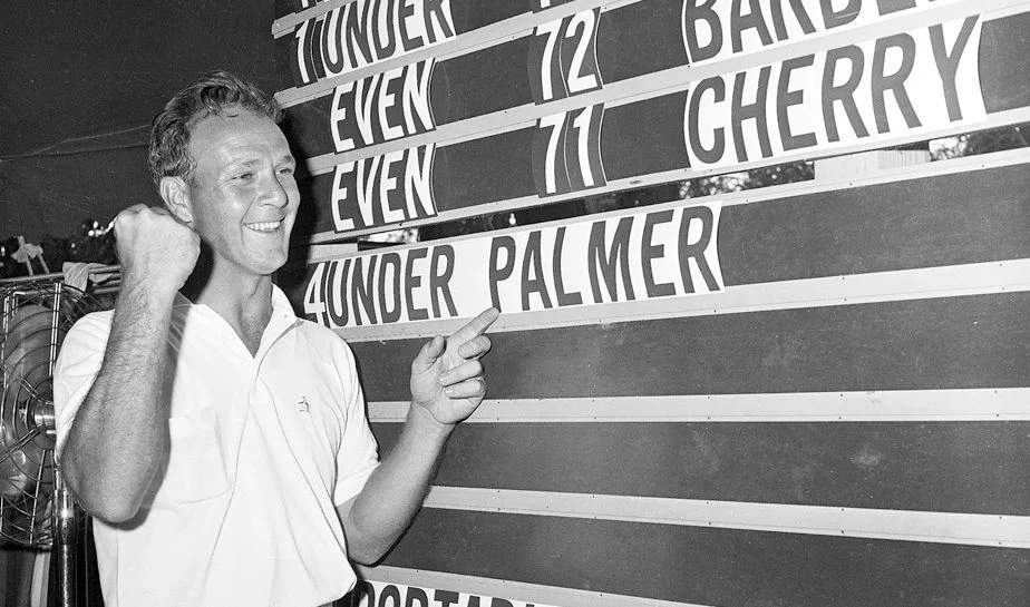 Arnold Palmer points to his name on the leader board at the 1960 U.S. Open tournament in Denver, Colorado on June, 19, 1960. Palmer won the tournament with a score of 280.