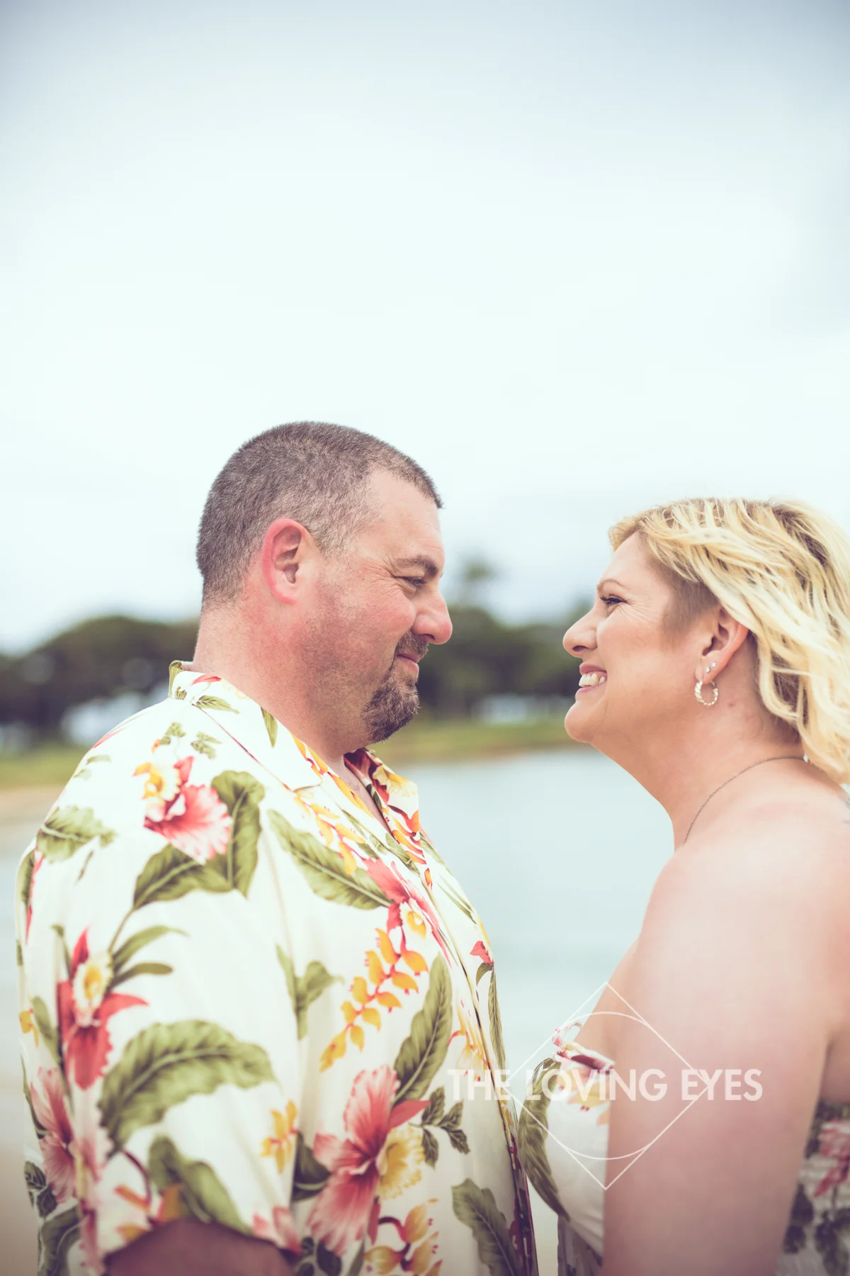 Couple portrait on the beach during Hawaii vacation at Ala Moana Beach Park