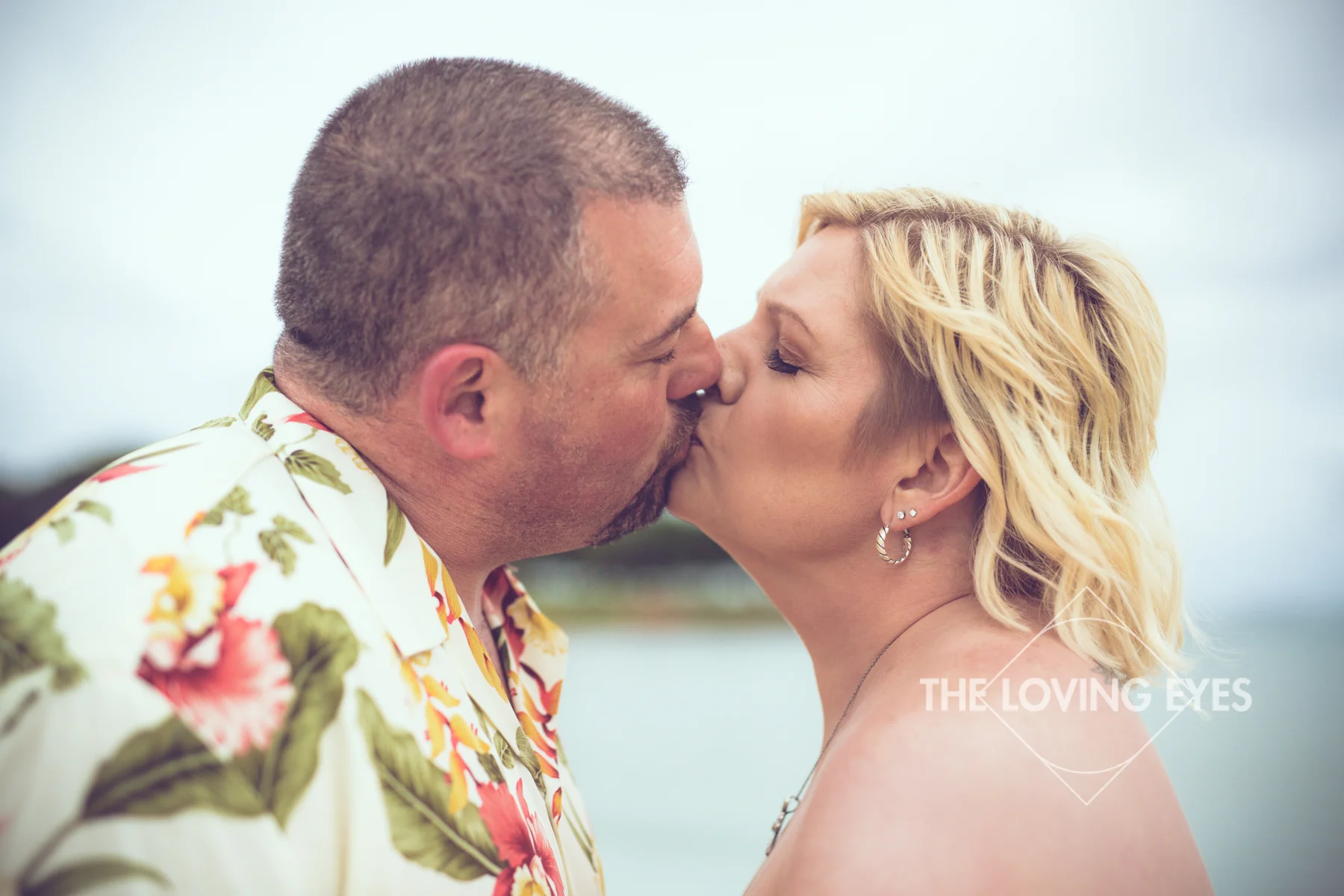 Kissing on the beach during Hawaii vacation at Ala Moana Beach Park