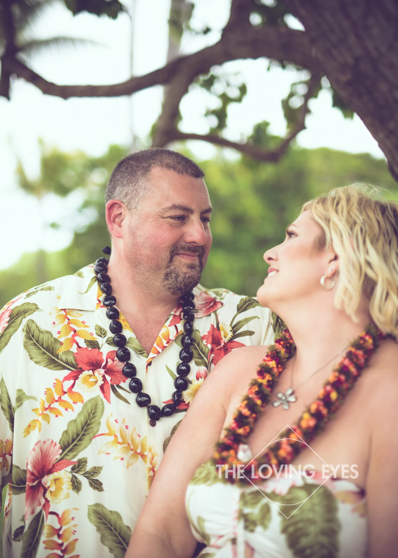 Couple portrait on the beach during Hawaii vacation at Ala Moana Beach Park