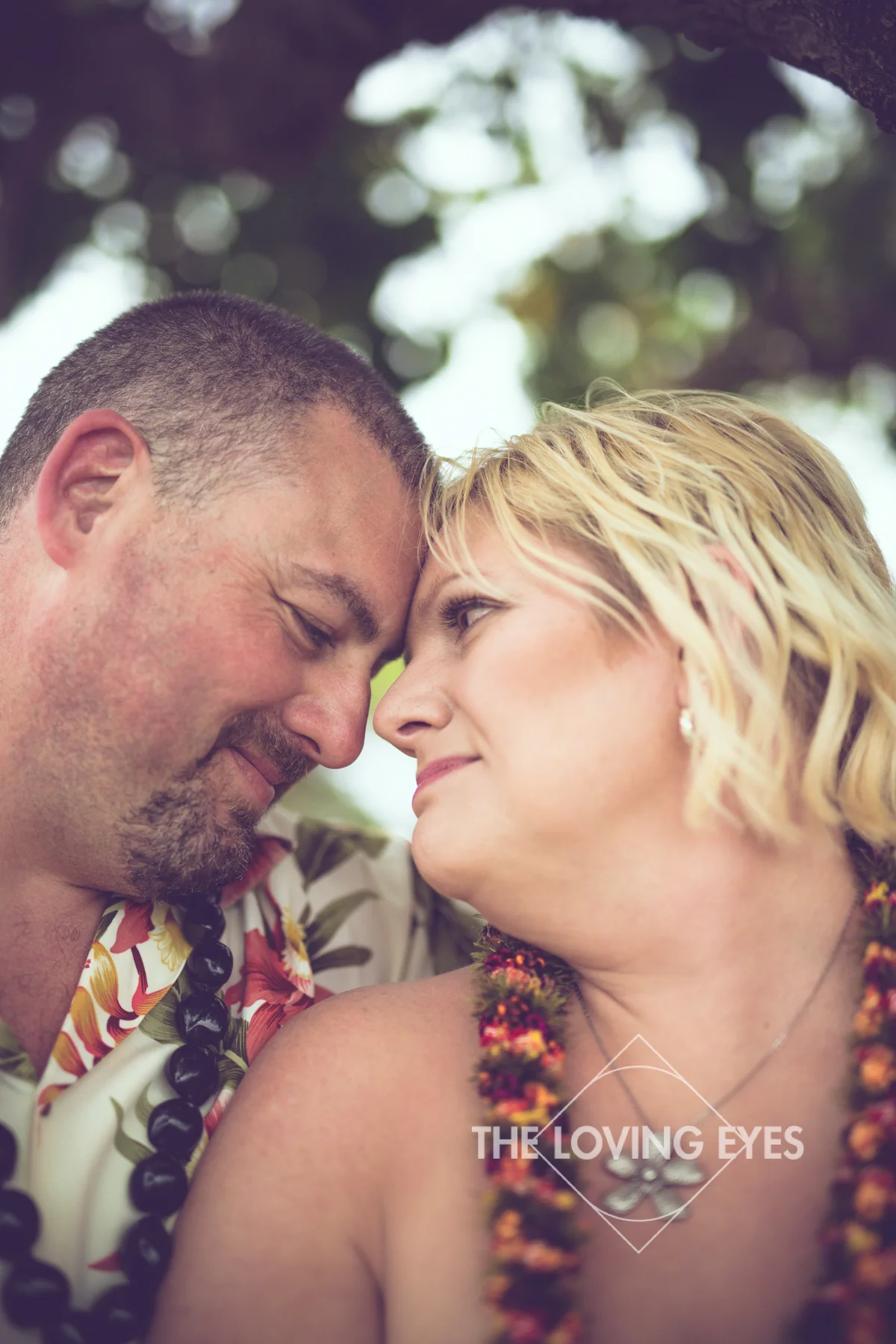 Couple portrait on the beach during Hawaii vacation at Ala Moana Beach Park