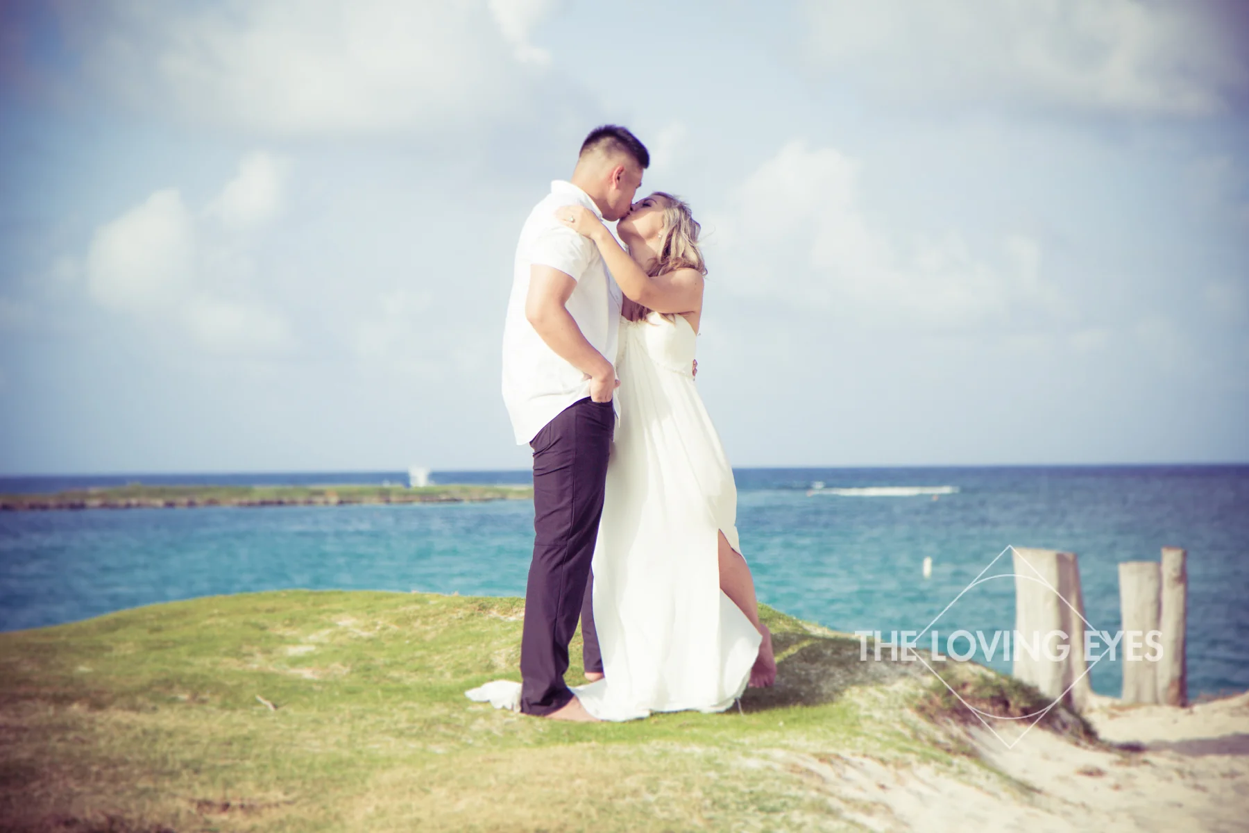 Couple kissing during Hawaii engagement photography on Kailua Beach