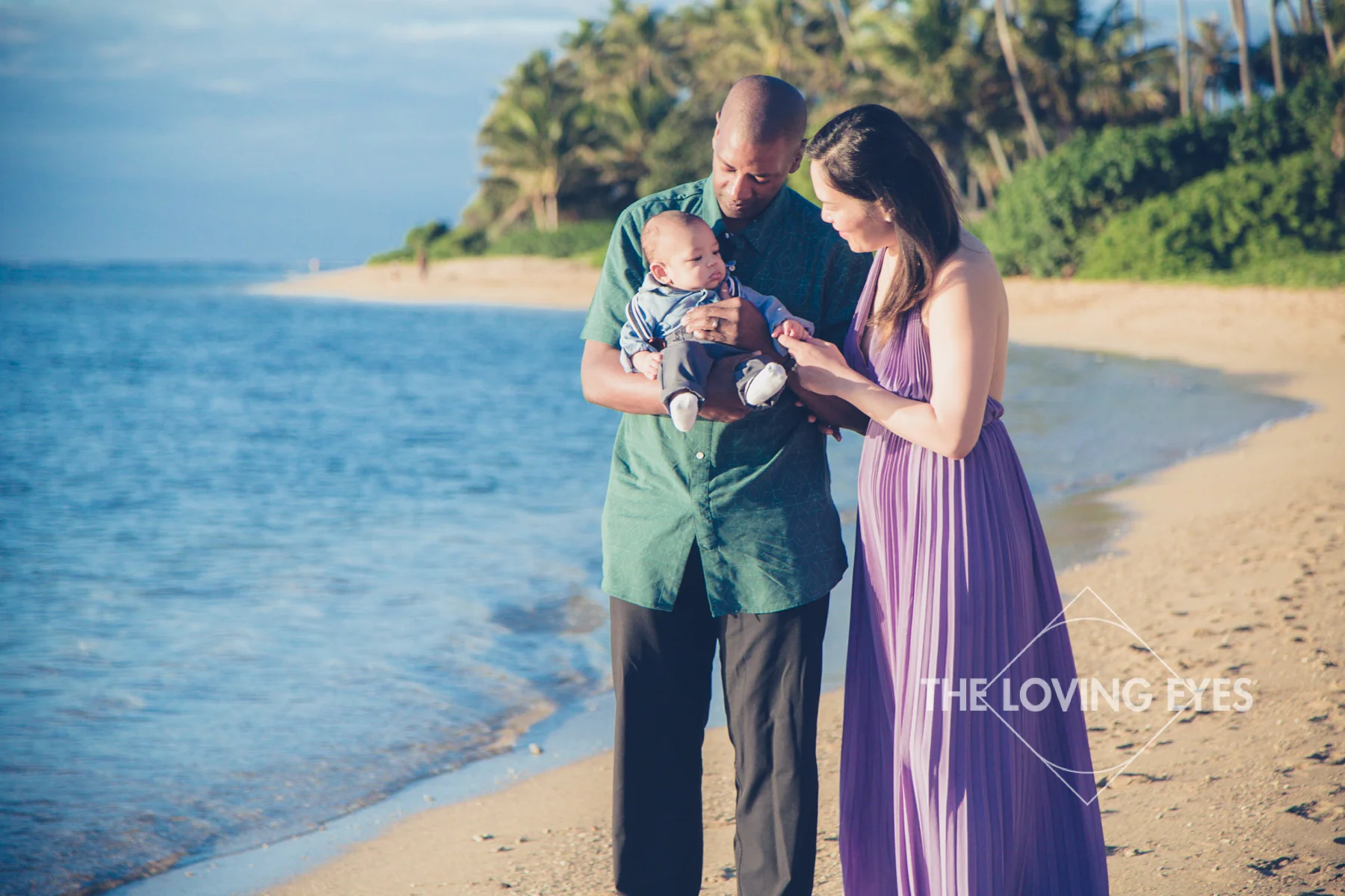 Family portrait on the beach during vacation in Hawaii